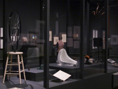 Installation view of the Dalí / Duchamp Exhibition at the Royal Academy of Arts, showing 'Bicycle Wheel' and 'Fountain' by Marcel Duchamp