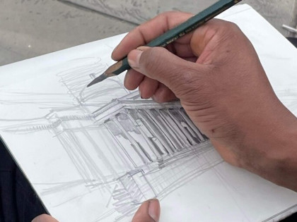 Artist Adebanji Alade drawing a building 