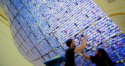 Art handlers work on installing 'THE PORTRAIT OF SAKIP SABANCI' by Turkish artist Kutlu? Ataman in the Summer Exhibition 2016