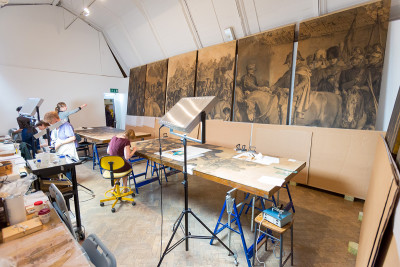 Conservators working on the Maclise cartoon