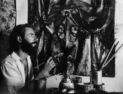 Alan Davie painting in his studio in the 1940s
