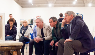 Members of the Summer Exhibition 2014 Selection and Hanging Committee inspect a work submitted for the exhibition