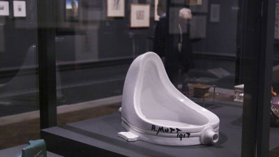 Installation view of the Dalí / Duchamp Exhibition at the Royal Academy of Arts, London, showing 'Fountain' by Marcel Duchamp