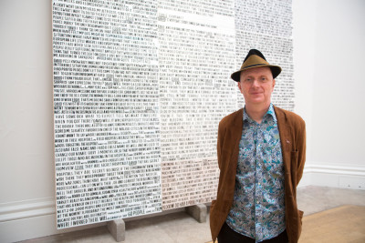 Bob and Roberta Smith RA in front of his work 'Interview with David Nott by Eddie Mair'