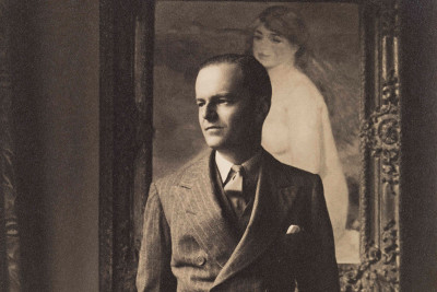 Kenneth Clark at his home in Saltwood Castle, Kent, in front of a painting by Renoir.