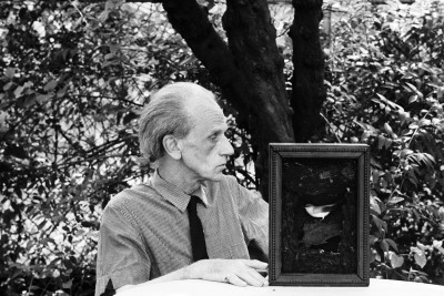 Joseph Cornell poses for a portrait in 1967 at his home and studio in Flushing, Queens, New York