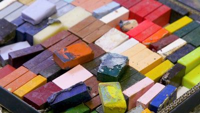 A tray of wax pellets used in encaustic painting