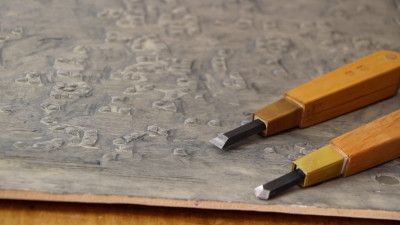 Carving tools lie on a block for Rebecca Salter's Japanese woodblock print "Tessela 1 and 2', on show in the Summer Exhibition 2016