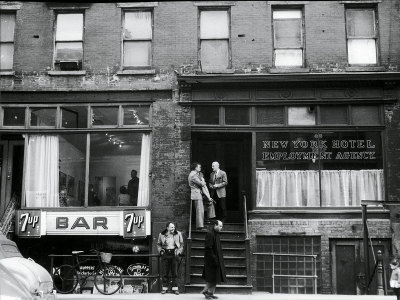 Willem de Kooning (centre with light hair) talks to author Noel Clad and his wife on East 10th Street, next door to the Tanager Gallery, 1959