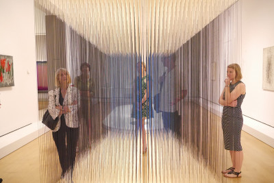 Curator Gabriel Perez-Barreiro gives Patrons a tour of 'Radical Geometry' before it opens to the public