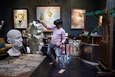 Artist Jonathan Yeo in his Chelsea studio using Google Tilt Brush to create a self-portrait sculpture in virtual reality from a 3D scan of himself