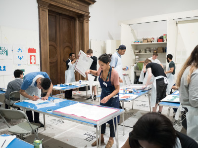 Artist Diana Taylor leads a workshop for college students as part of the RA’s hoardings project