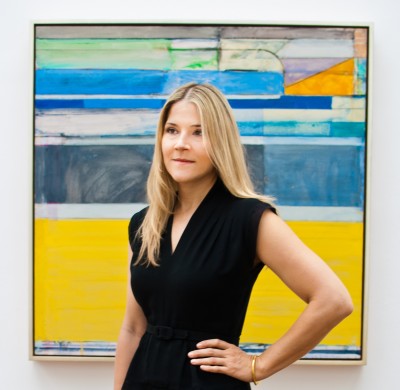 Sarah C. Bancroft standing in front of the Richard Diebenkorn painting 'Ocean Park #117' (1979)