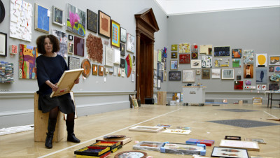 Tess Jaray RA has chosen to hang the walls of the grand Gallery III with small-scale works to showcase emerging talent