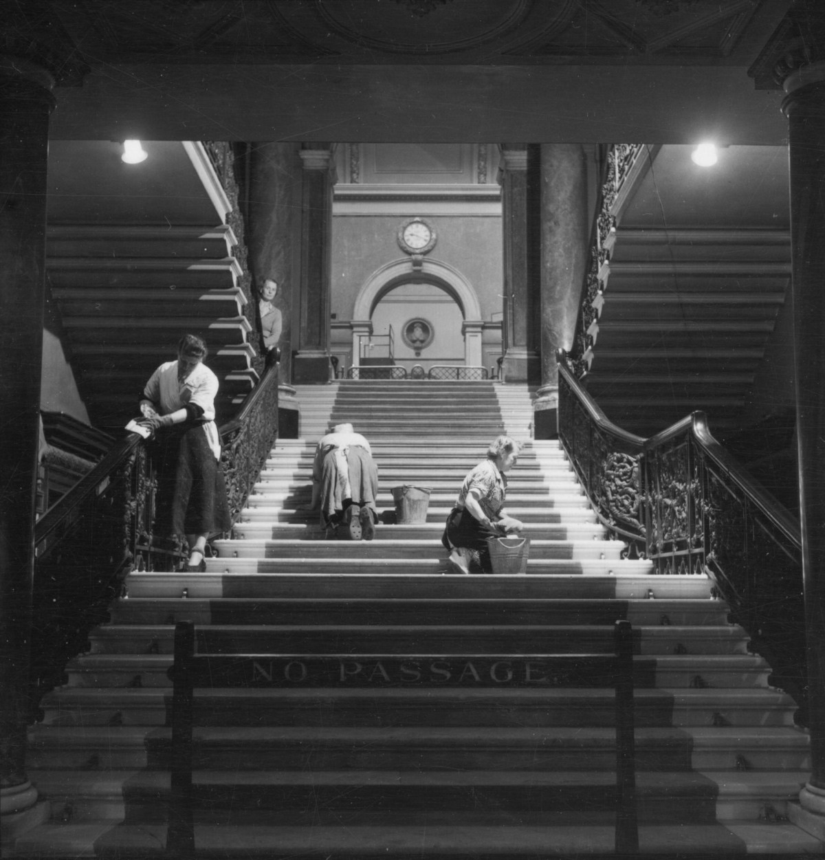 Russell Westwood, Cleaning staff at work on the main staircase, Royal Academy of Arts, Burlington House, 1953.