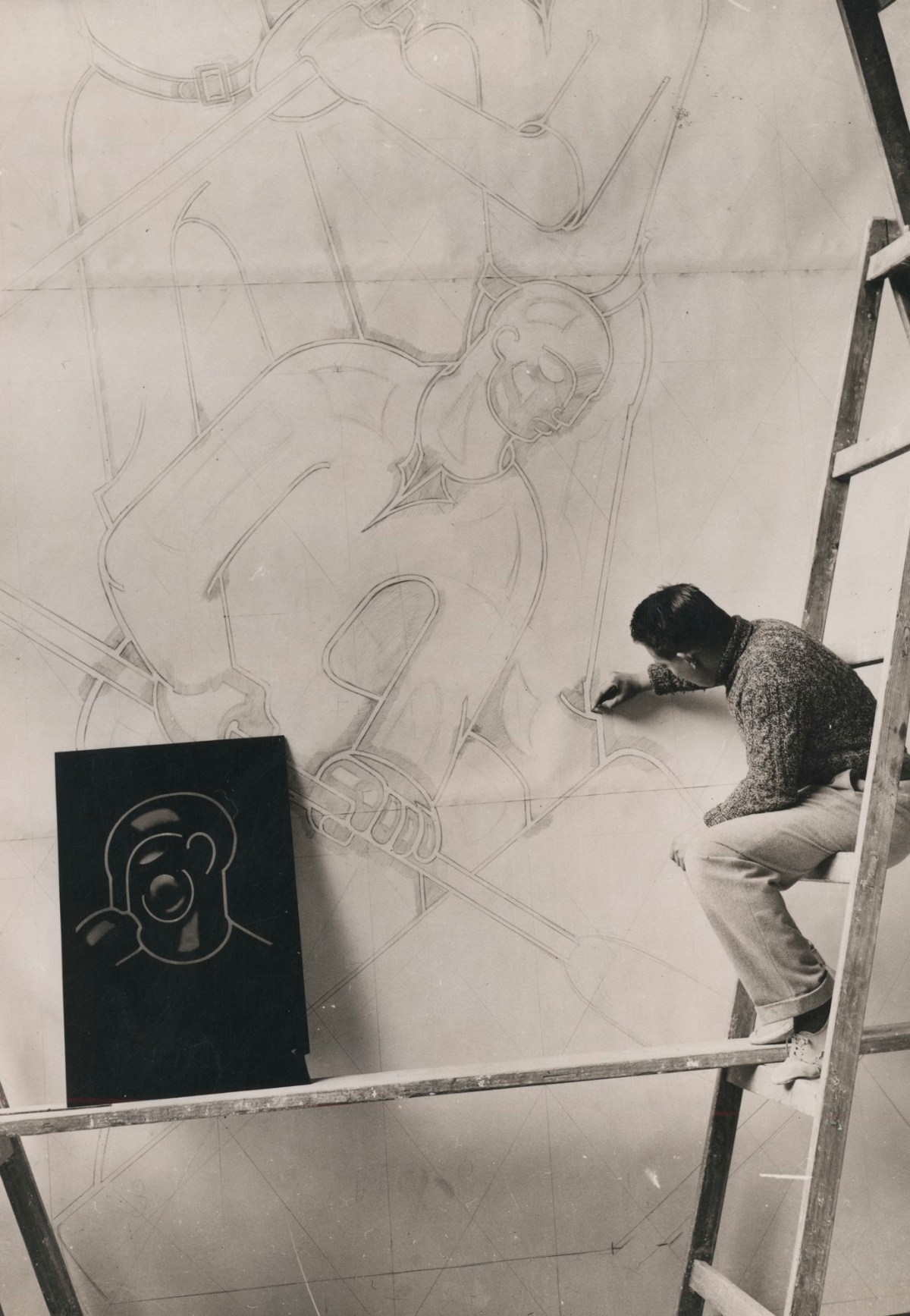 Unidentified photographer, Maurice Lambert R.A. in his studio working on a design for 'Glassblowers', 1934