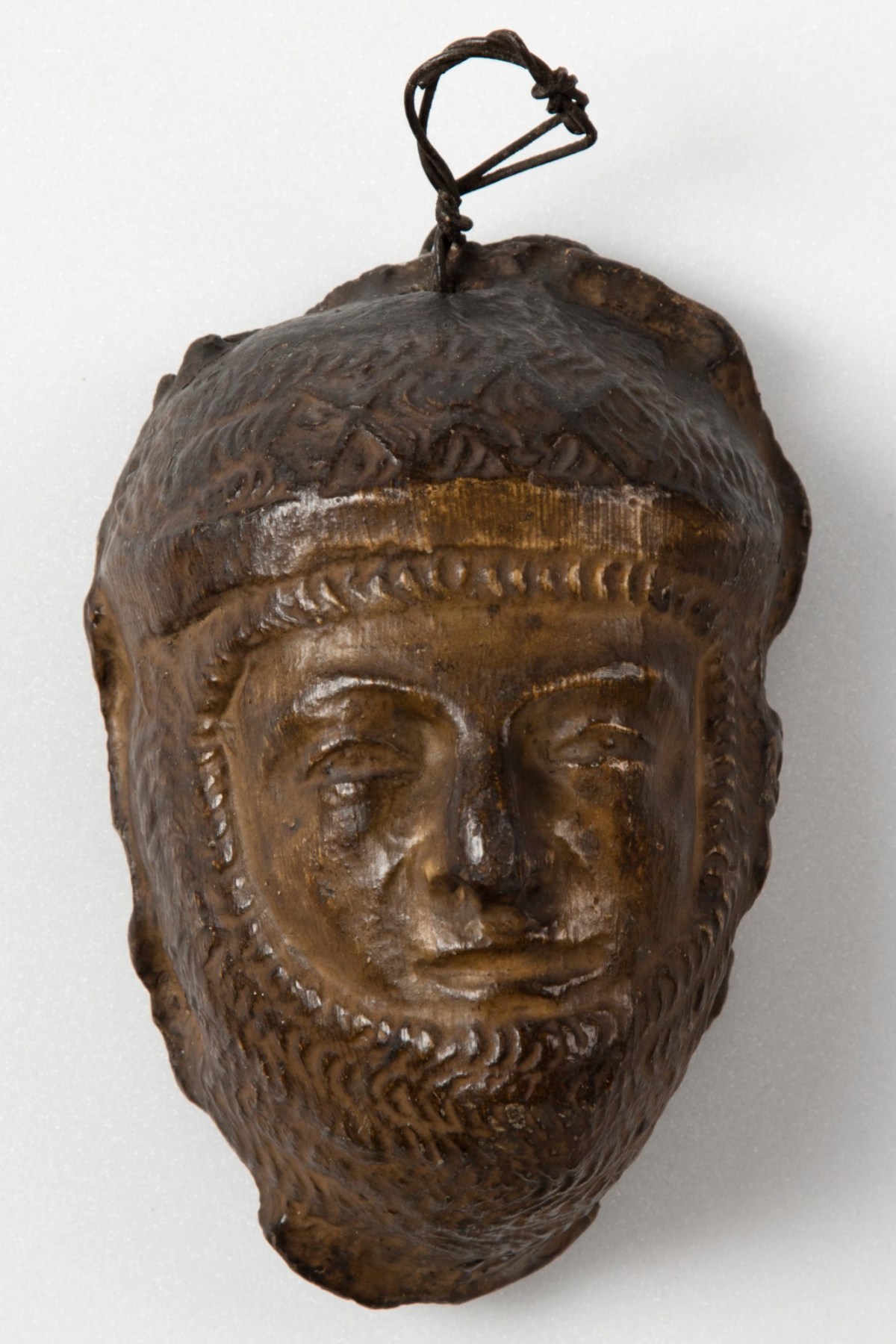 , Brown painted plaster cast of male figure in armour or chain mail