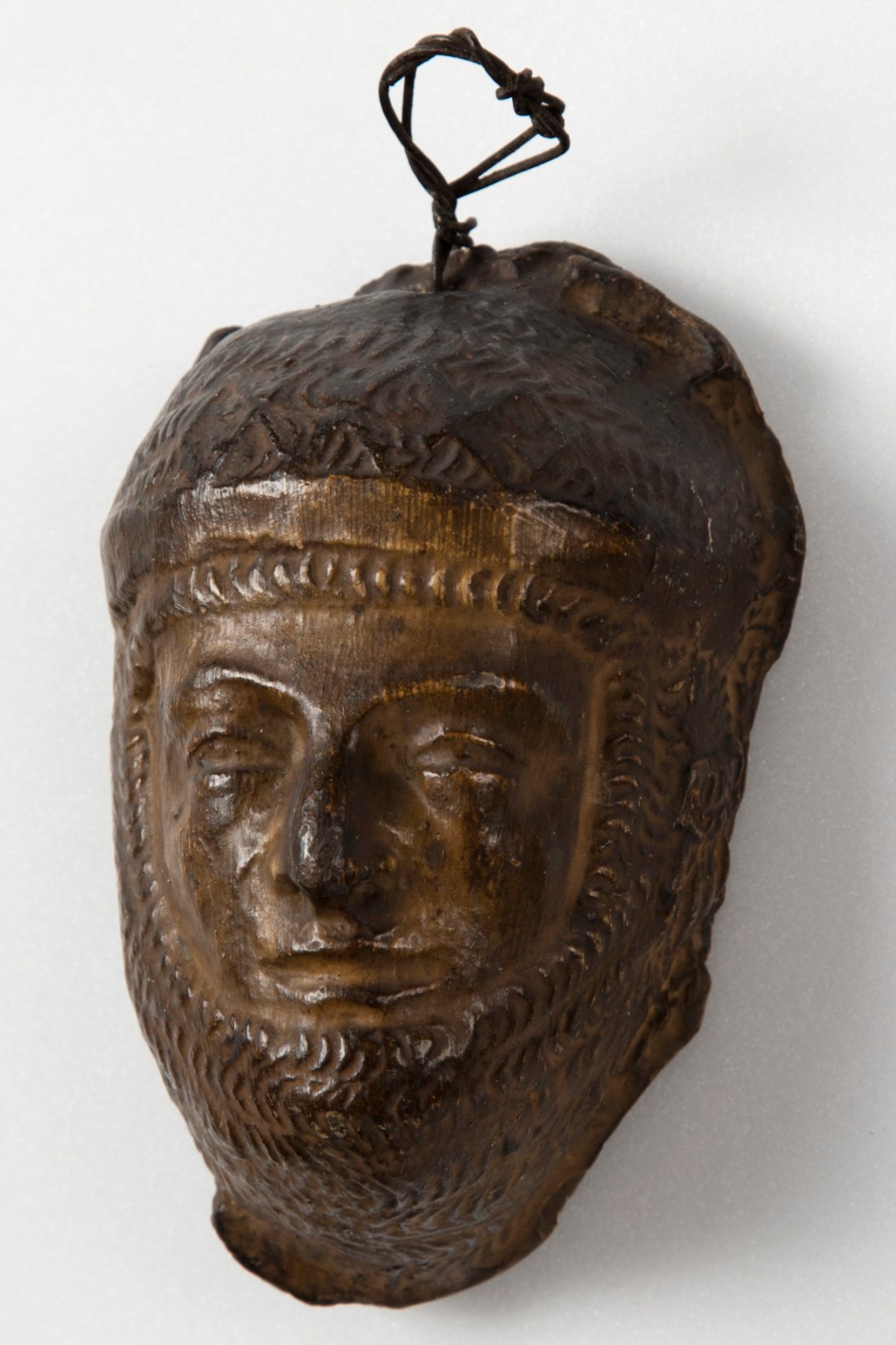 , Brown painted plaster cast of male figure in armour or chain mail
