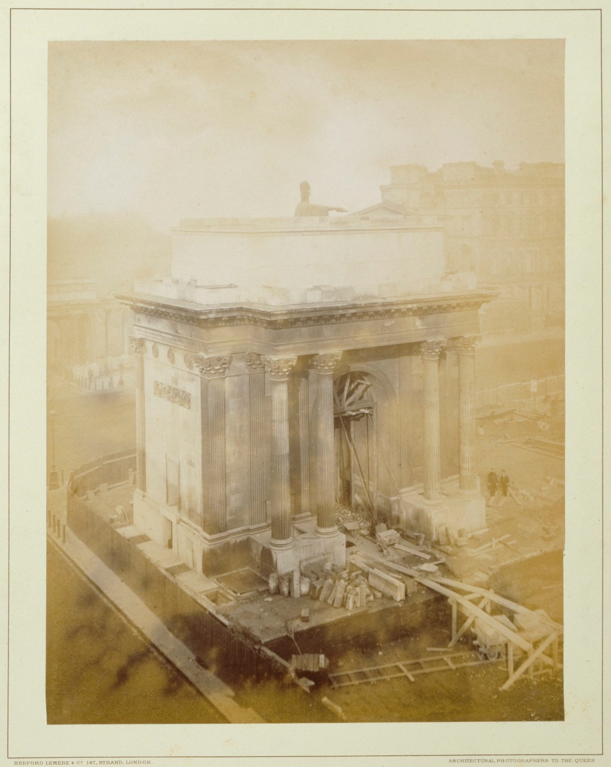 Bedford Lemere & Co., Photograph of the Wellington Arch, Jan 22nd 1883 showing the statue being lowered.