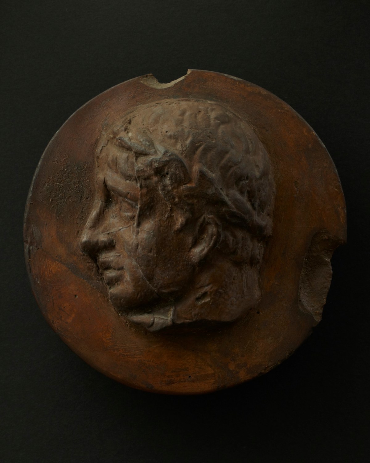 Cast of cleanshaven Roman man wearing a wreath Works of Art RA