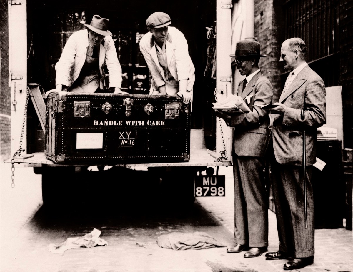Topical Press Agency, Sir Walter Lamb and Zhuang Shangyan (Chuang Shang-yen) checking cases as they arrive at Burlington House. The International Exhibition of Chinese Art at the Royal Academy 1935-6. Photograph by an unknown photographer from Topical Press Agency.