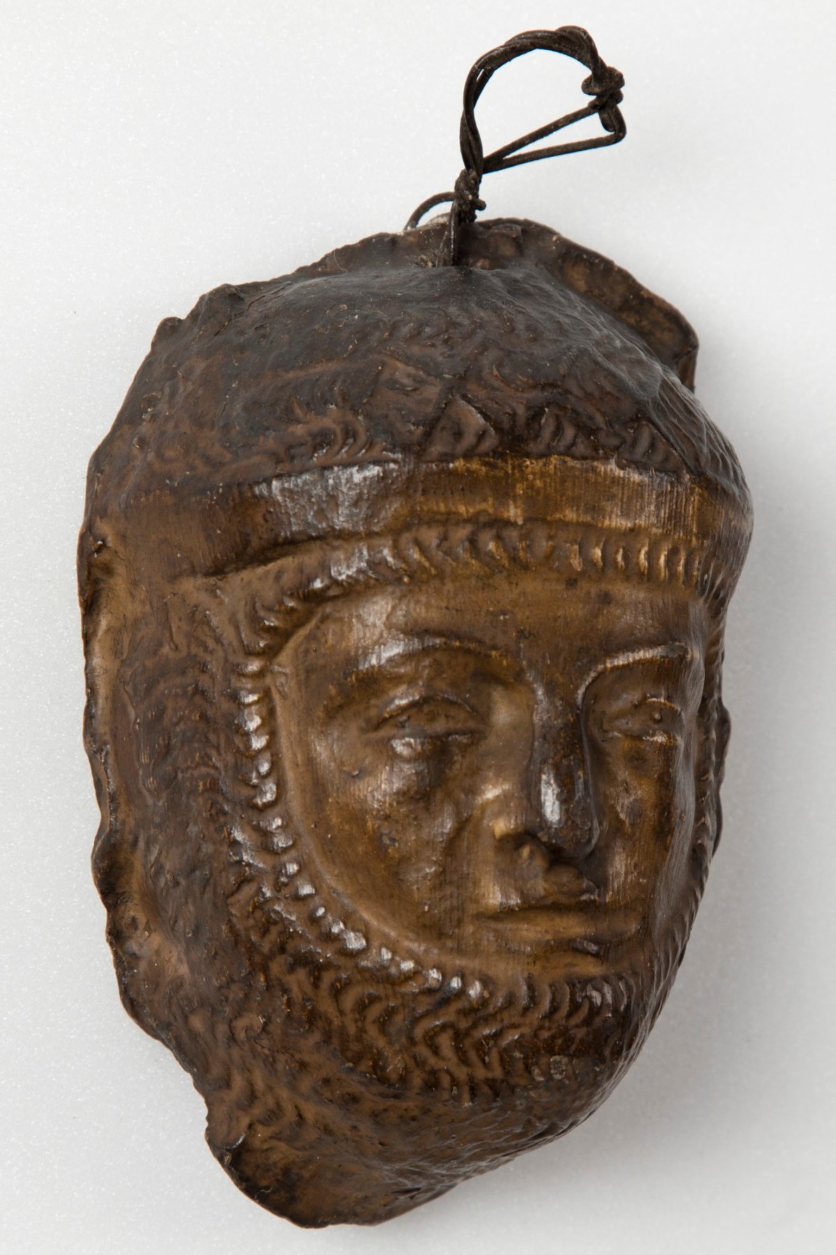 , Brown painted plaster cast of male figure in armour or chain mail
