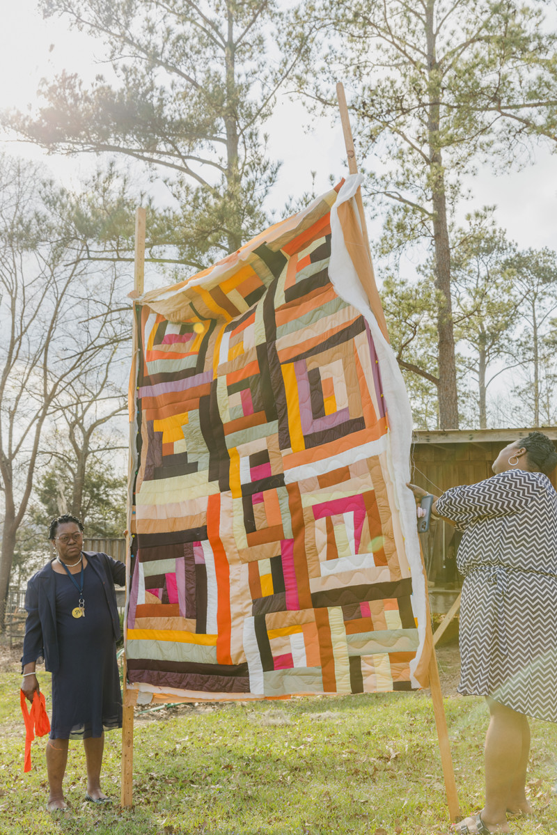 Monica Waller and Doris Pettway-Mosely showing their quilt