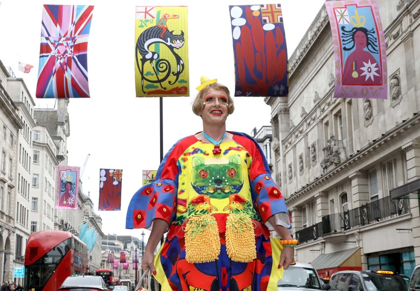 Grayson Perry RA with his flags on Piccadilly