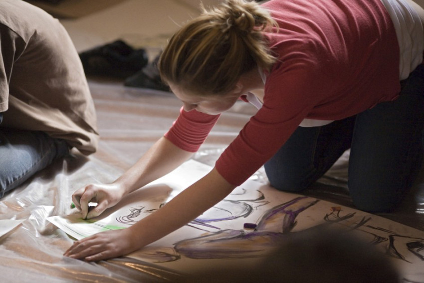 Students drawing at an Outreach Workshop