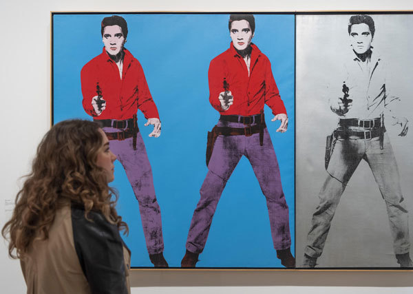 Installation view of Andy Warhol at Tate Modern featuring Andy Warhol's Elvis I and II 1963; 1964.