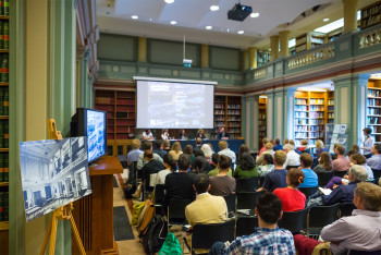 People watching panel discussion event in the library