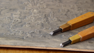 Carving tools lie on a block for Rebecca Salter's Japanese woodblock print "Tessela 1 and 2', on show in the Summer Exhibition 2016