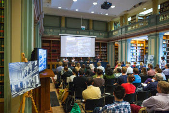 People watching panel discussion event in the library